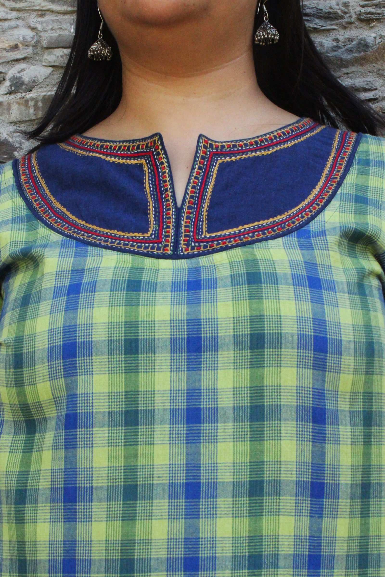 Woman wearing Kashmiri-inspired checkered cotton kurta with navy blue embroidered yoke and long sleeves.