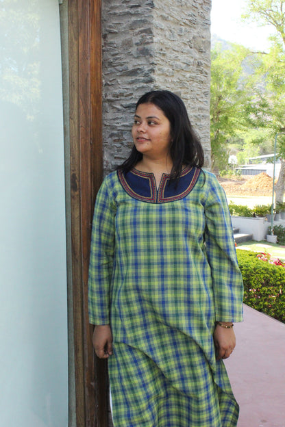 Woman wearing Kashmiri-inspired checkered cotton kurta with navy blue embroidered yoke and long sleeves.