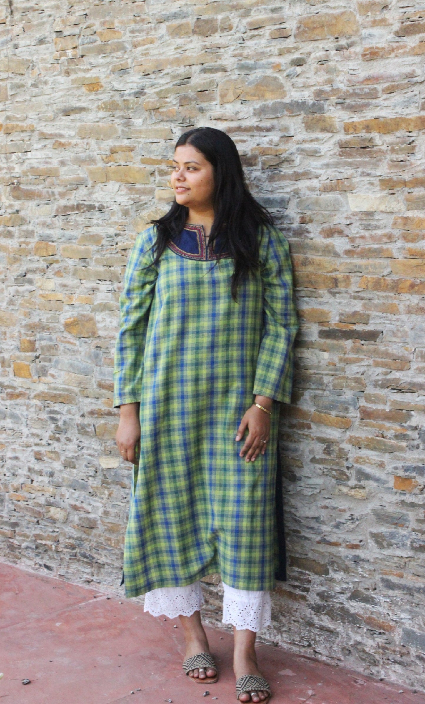 Woman wearing Kashmiri-inspired checkered cotton kurta with navy blue embroidered yoke and long sleeves.