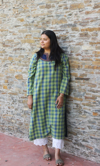 Woman wearing Kashmiri-inspired checkered cotton kurta with navy blue embroidered yoke and long sleeves.