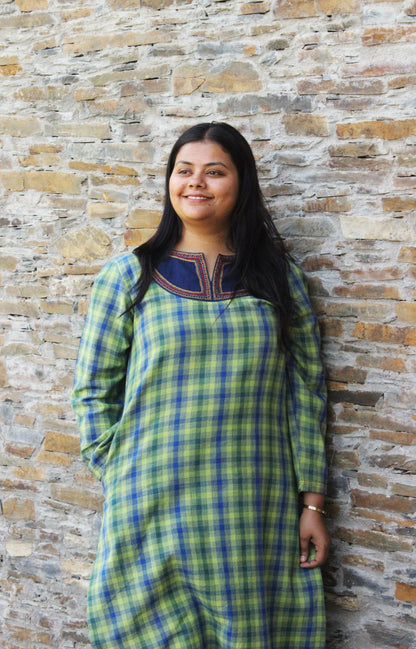 Woman wearing Kashmiri-inspired checkered cotton kurta with navy blue embroidered yoke and long sleeves.