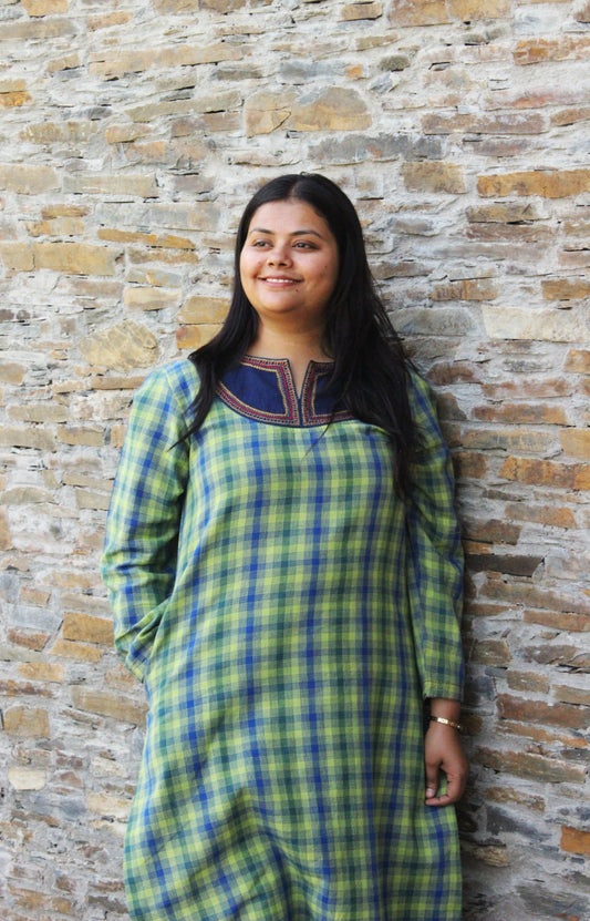 Woman wearing Kashmiri-inspired checkered cotton kurta with navy blue embroidered yoke and long sleeves.