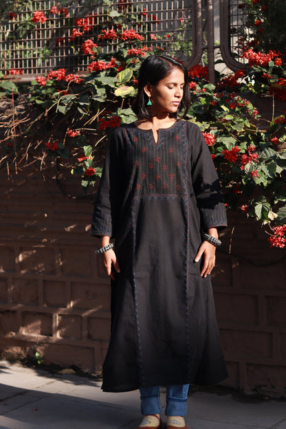 Front view of a woman wearing a Tanka embroidered cotton kurta featuring traditional handmade Indian embroidery, sustainable ethnic wear with side pocket